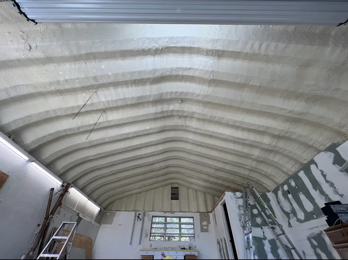 Spray polyurethane foam applied to the underside of a metal roof deck in Jasper